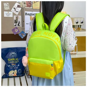 Sac à dos grand format color-block pour étudiants, cartable vert néon et jaune élégant.