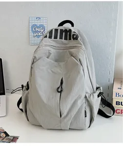 Casual grey waterproof school backpack for students, stylish daily travel daypack.