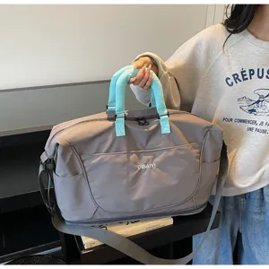 Large capacity travel duffel bag with shoulder strap, waterproof casual gym luggage bag for women.