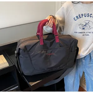 Large capacity travel duffel bag with durable handles and shoulder strap for fitness and sports.
