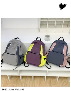 Stylish student school backpack with contrast color design for daily use and travel.