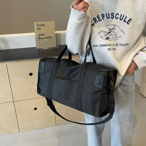 Black large capacity travel duffel bag with shoulder strap, casual style for daily use.