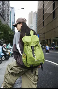 Outdoor casual waterproof backpack, large capacity travel school bag in green style.