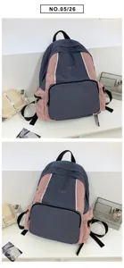Detail view of casual colorblock backpack with front zipper pocket and adjustable shoulder straps.