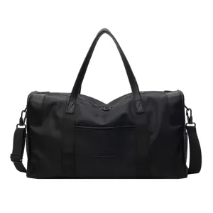 Classic black travel duffel bag with shoulder strap, large capacity waterproof sports gym bag.