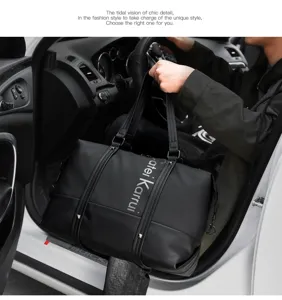 Detailed view of black men's travel duffel bag, large capacity business luggage for trip.