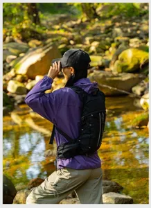 Detailed view of black hiking backpack, lightweight outdoor sports rucksack for travel.