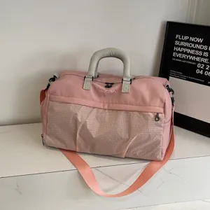Stylish pink gym duffel bag for travel and sports, large capacity with wet pocket.