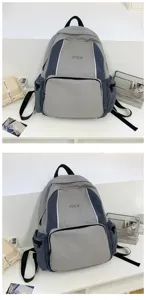 Detail view of the stylish grey contrast backpack showcasing front pocket and durable fabric.