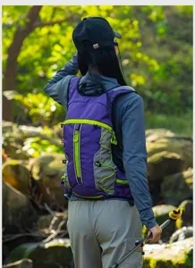 Outdoor hiking sports backpack in purple and grey, showing back design for cycling.