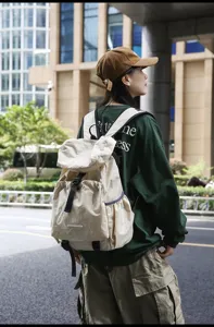 Casual outdoor travel backpack for men and women, large capacity waterproof canvas bag.