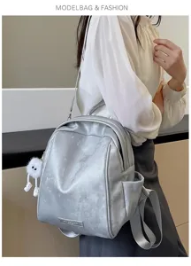Stylish silver fashion backpack for women, large capacity travel casual daypack daily use.