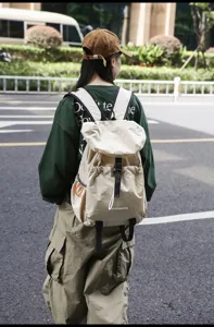 Casual outdoor travel backpack detail view, lightweight waterproof campus book bag for daily use.