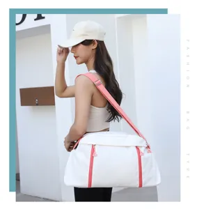 White sports gym bag with stylish pink straps and zippers, showing perfect detail.