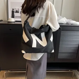 Canvas shoulder tote bag for women, chic Japanese style casual crossbody handbag daily use.