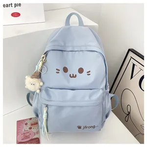 Cute cartoon backpack for girls, lightweight casual school bag with plush pendant, detail view.