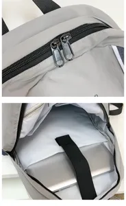 Lightweight gray casual school backpack with laptop compartment and dual zippers for students.