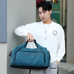 Large capacity travel duffel bag for men, waterproof gym fitness bag with compartments.