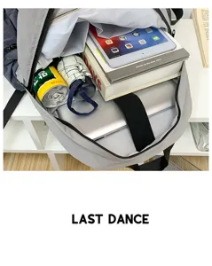 Grey minimalist student backpack detail showing large capacity laptop and tablet compartment.