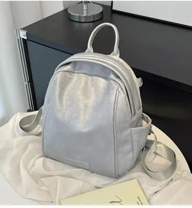 Stylish silver backpack for women, trendy commuting and travel daypack with spacious capacity.