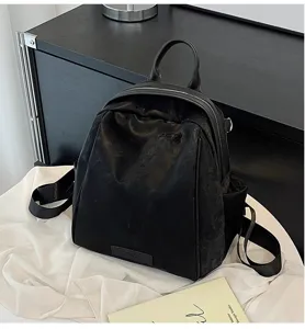 Classic black leather women's backpack for daily commute, travel, and casual fashion use.