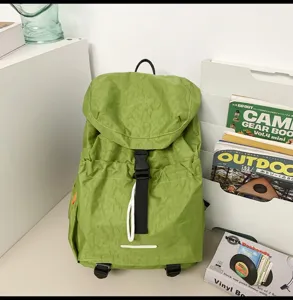 Casual large capacity green nylon backpack for outdoor travel, lightweight and waterproof school bag.