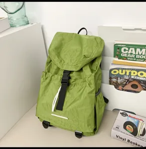 Detail view of a lightweight green casual backpack, waterproof travel and outdoor daypack.