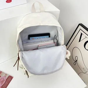 Minimalist white casual backpack with spacious interior, perfect for daily school and travel use.