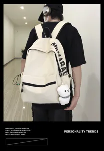 Simple solid color canvas backpack casual campus student school bag with cute bear pendant.