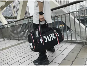 Large capacity sports duffel bag for gym yoga travel, durable black weekender with strap.