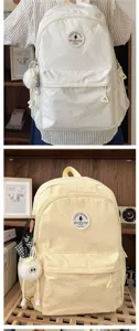 Große kapazität minimalistischer studenten rucksack lässige schultasche mit plüschanhänger.