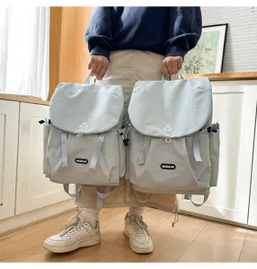 Large capacity casual backpack for students commuters outdoor travel light blue stylish school bag
