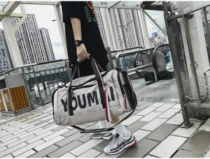 Large capacity sports travel duffel bag with shoe compartment for gym and fitness use