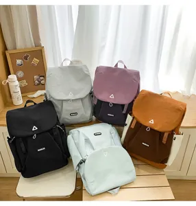 Detailed view of multi-color casual backpacks, large capacity, student school bag, commuter daypack.