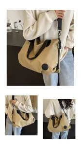 Casual large-capacity nylon shoulder bag detail, featuring durable fabric and wide black straps.
