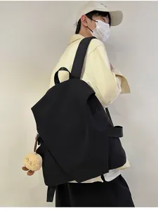 Zaino nero minimalista per uomo e donna, borsa da scuola elegante e da viaggio.