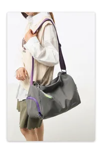 Detailed view of large capacity gray yoga fitness bag with purple straps for travel.