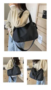 Detailed view of the large casual black nylon shoulder bag, showing lifestyle carrying angles.