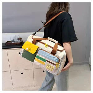 Elegante borsa da viaggio in tela multicolore con grande capienza e tasche multiple.
