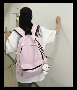 Korean style pink canvas school backpack for teen girls casual daypack with cute pendant.