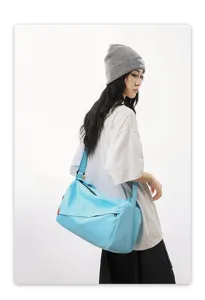 Lightweight blue sports duffel bag, waterproof gym fitness bag for travel and casual use.