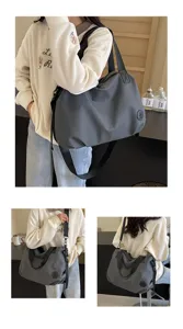 Close-up detail of large capacity nylon bag showing durable fabric and practical shoulder straps.