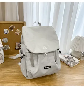 Grey daily commuting backpack detail, large capacity student school bag with durable fabric.