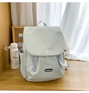 Light green casual campus backpack with flap and large capacity for daily student commuting.