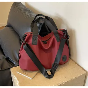 Casual large capacity nylon tote bag women travel shoulder crossbody bag for daily commute.