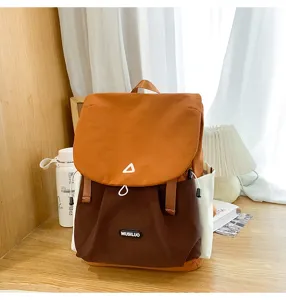 Trendy color block backpack for men and women, large capacity school bag for daily commute.