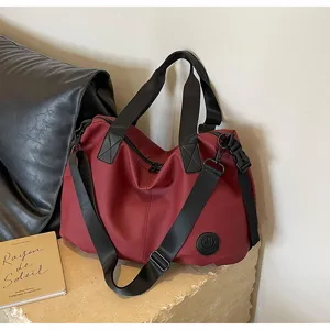 Casual large-capacity nylon tote bag, versatile shoulder and crossbody travel duffle for daily use.
