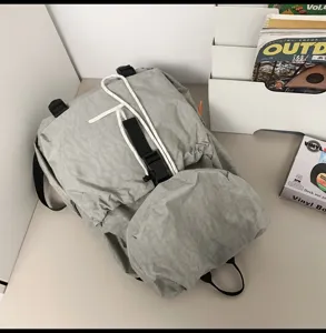 Lightweight grey outdoor travel backpack, casual waterproof school bag for daily use.