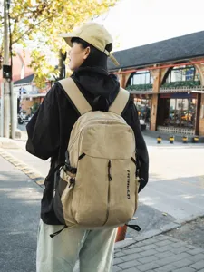 Grande zaino casual in tela per studenti, viaggi all'aperto e uso quotidiano moderno.