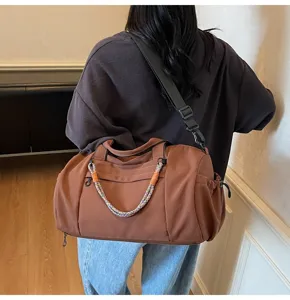 Large capacity brown travel duffel bag for women, sporty shoulder bag for gym yoga fitness.